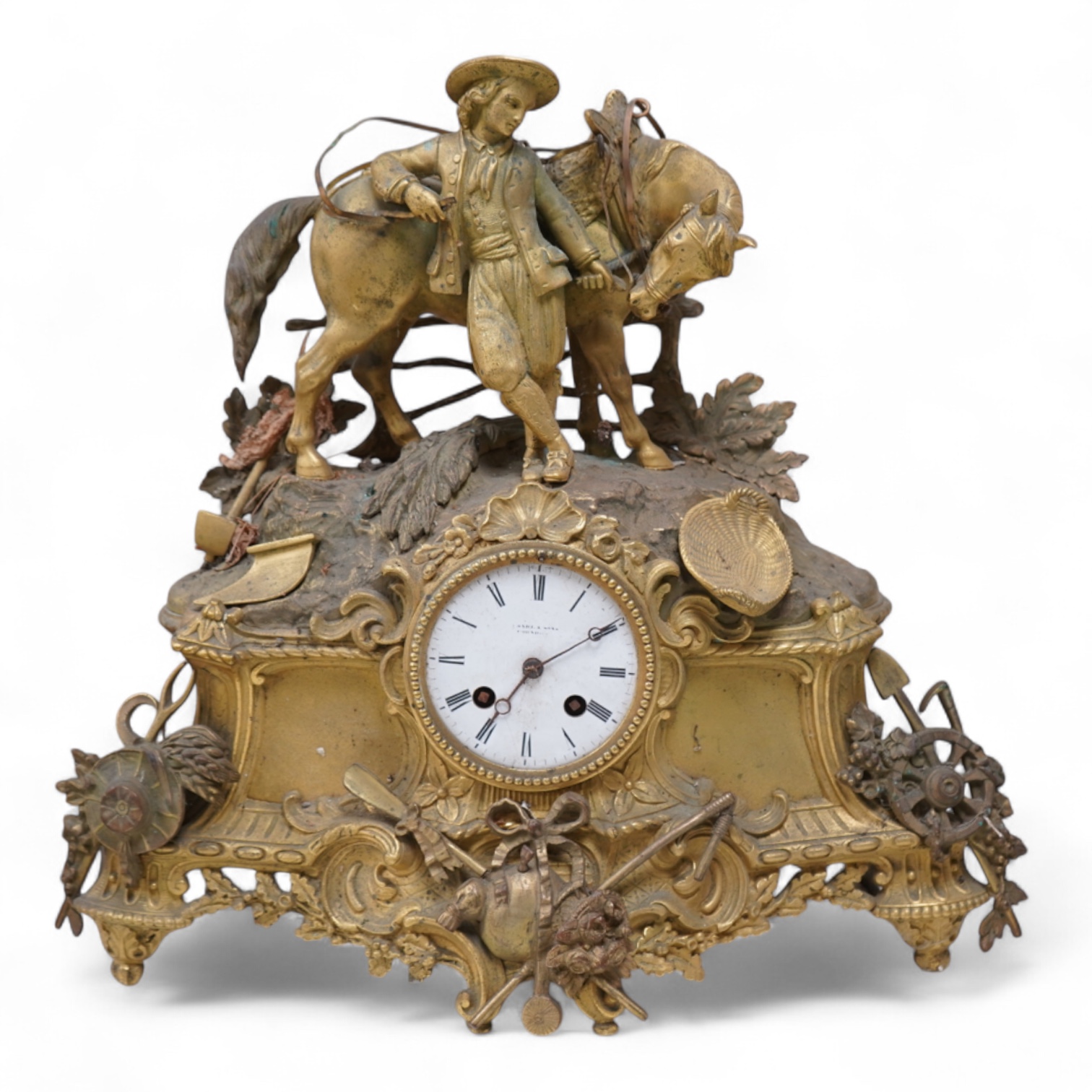 A 19th century French gilt spelter clock surmounted with a horse and rider, 39cm high